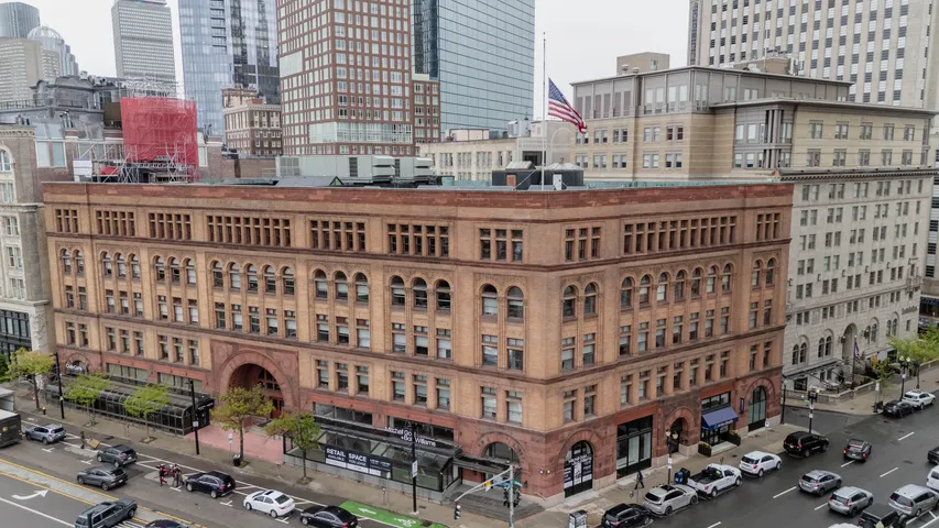 Historic brick building surrounded by city streets
