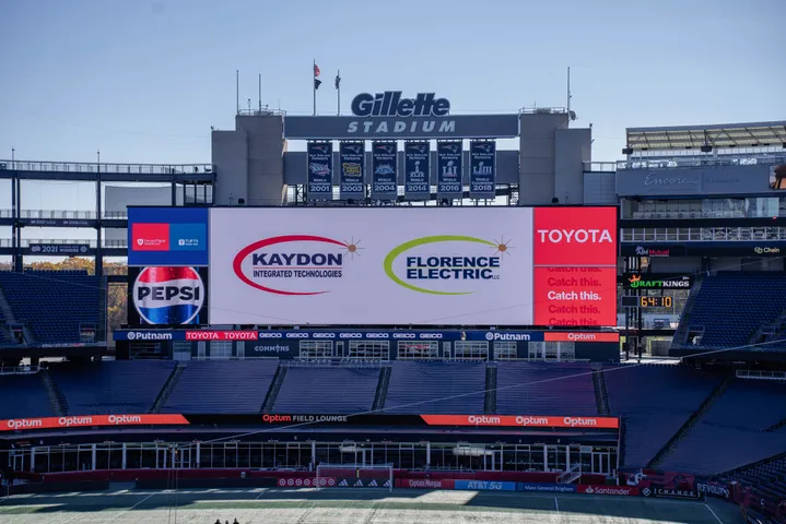 Stadium video board above a football field