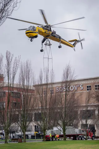 Helicopter hovering above a city work site